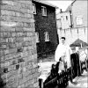 342. A resident outside masonette on Bordesley Park Road (Old Lodge in background).jpg