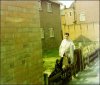 resident outside lodge with dog.JPG