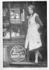 kate harrington outside the little shop she ran well st 1921.jpg