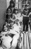 Gina at top, Sandy, Wendy, Sue Cox, Franny and Maria at bottom. Caselva balcony, June 1971.jpg